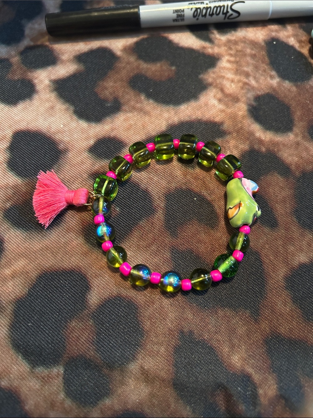 Hand Crafted Green Beaded Bracelet with Pink Tassel